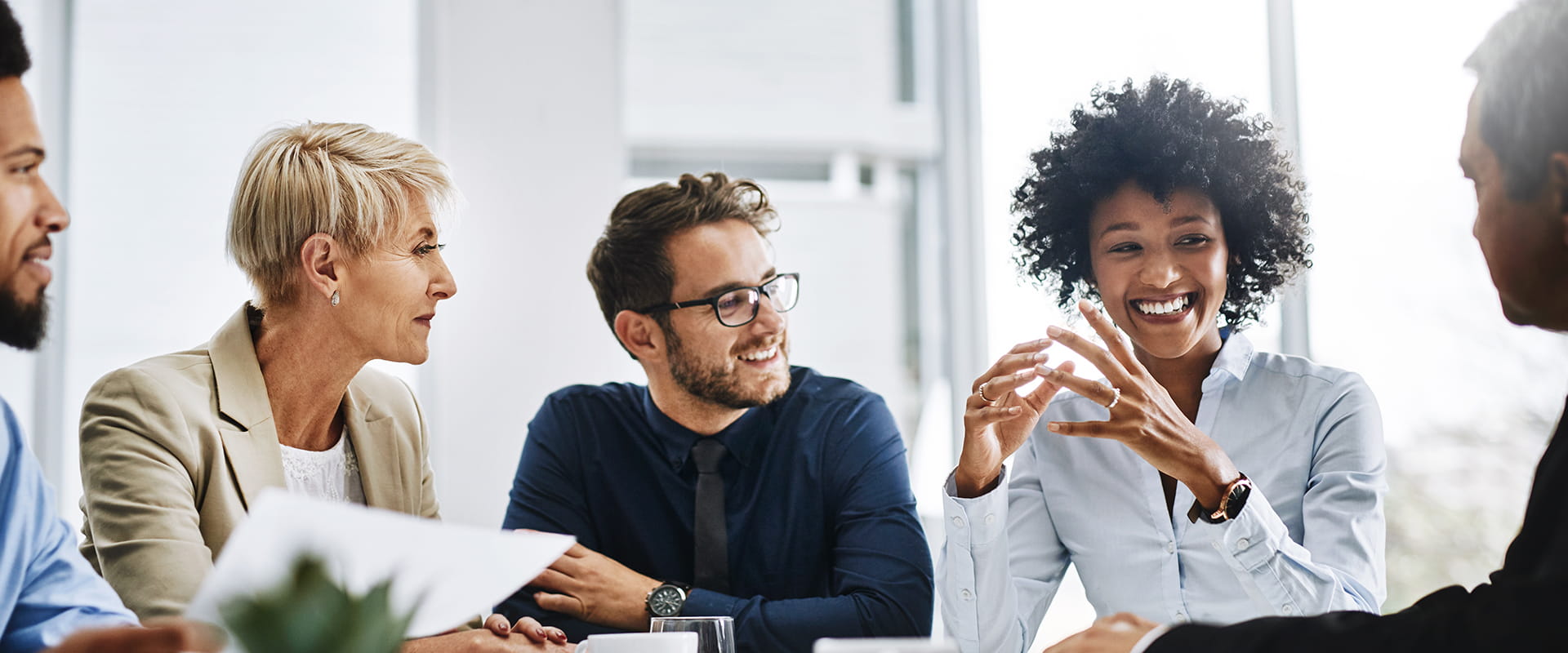 group of diverse colleagues having a conversation in a meeting group of diverse colleagues having a conversation in a meeting